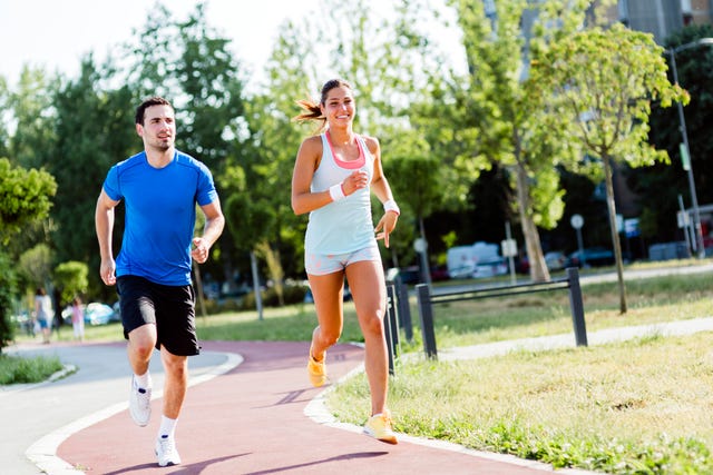 how to increase mileage running man and a woman jogging