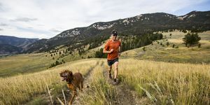 a man and  trail running