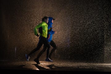 man and woman jogging in city