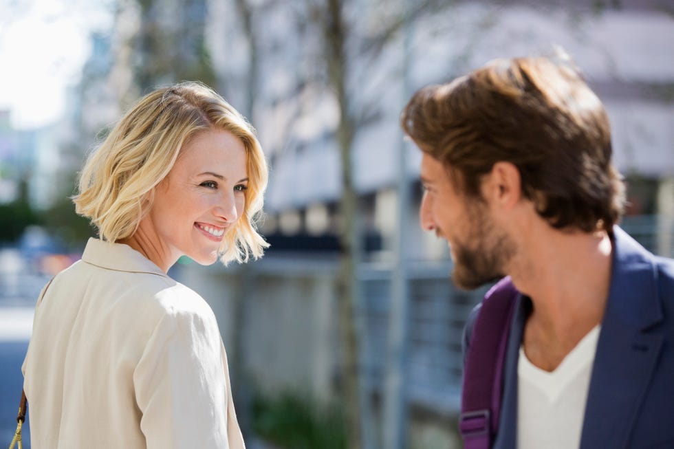 man and woman smiling at each other