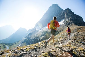 man and woman trail running