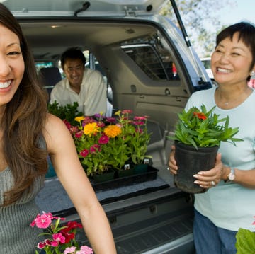 man and women loading plants