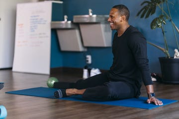 man attending group yoga class