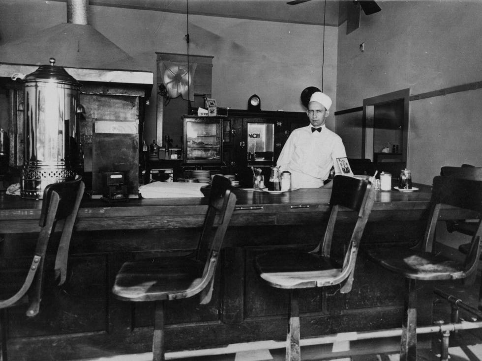 man behind counter of diner