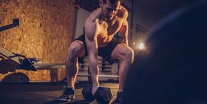 Man body building in gym