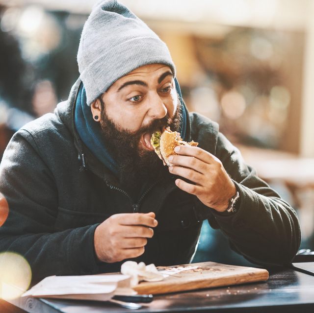a man eating a burger