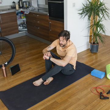 man checking his smartwatch post workout