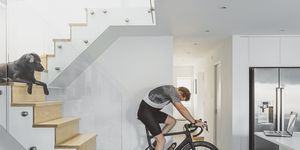 man cycling indoors on turbo trainer