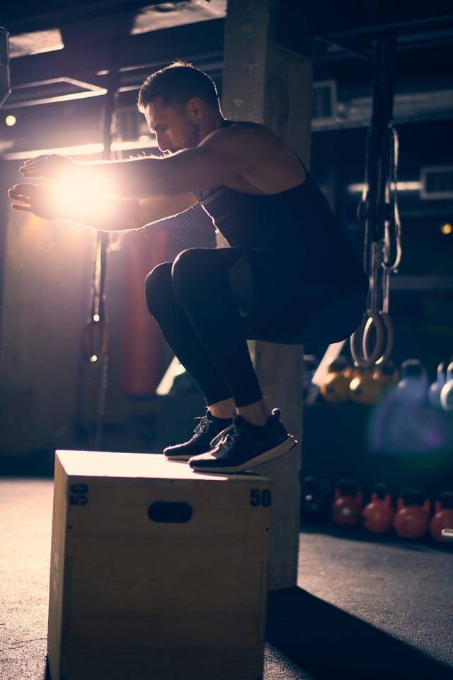Man doing box jumps