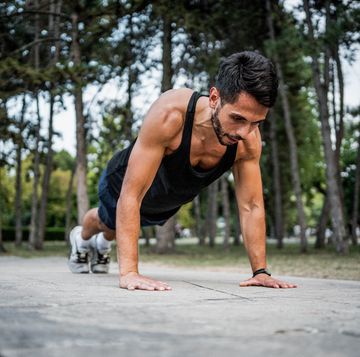 man doing push ups outdoors