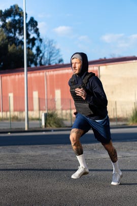 running with a weighted vest can build strength and change your body mass