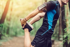 Man doing stretching exrecises in the park