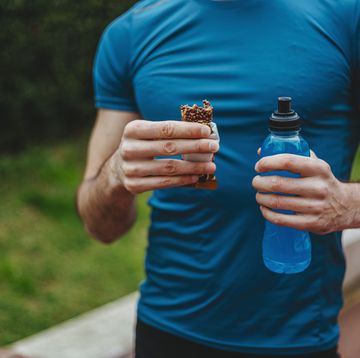 man eating energy bar