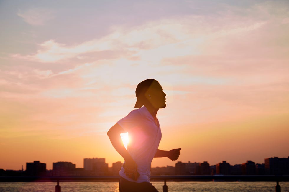 man enjoying an early morning jog in the city