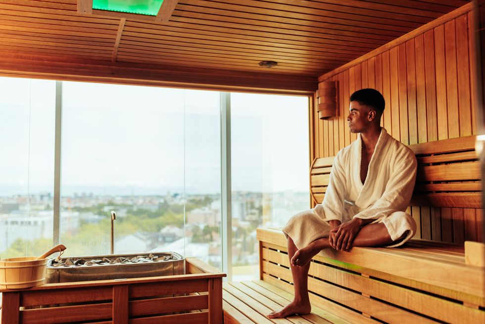 man enjoying view in sauna