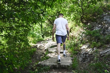 man exercising in woodland