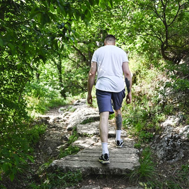 man exercising in woodland