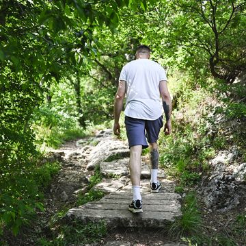 man exercising in woodland.