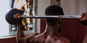 man exercising with barbell in gym,tema,ghana