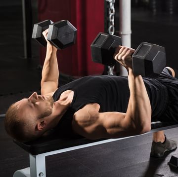 Man Exercising With Dumbbell