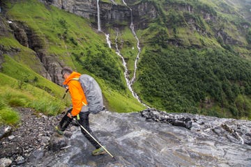 man hiking in rain