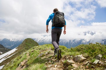 a man hiking in the mountains