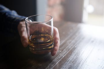 Man holding glass of whisky
