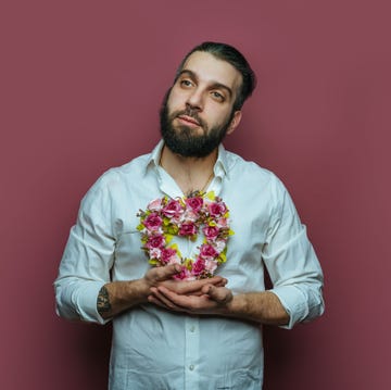 man holding small heart wreath