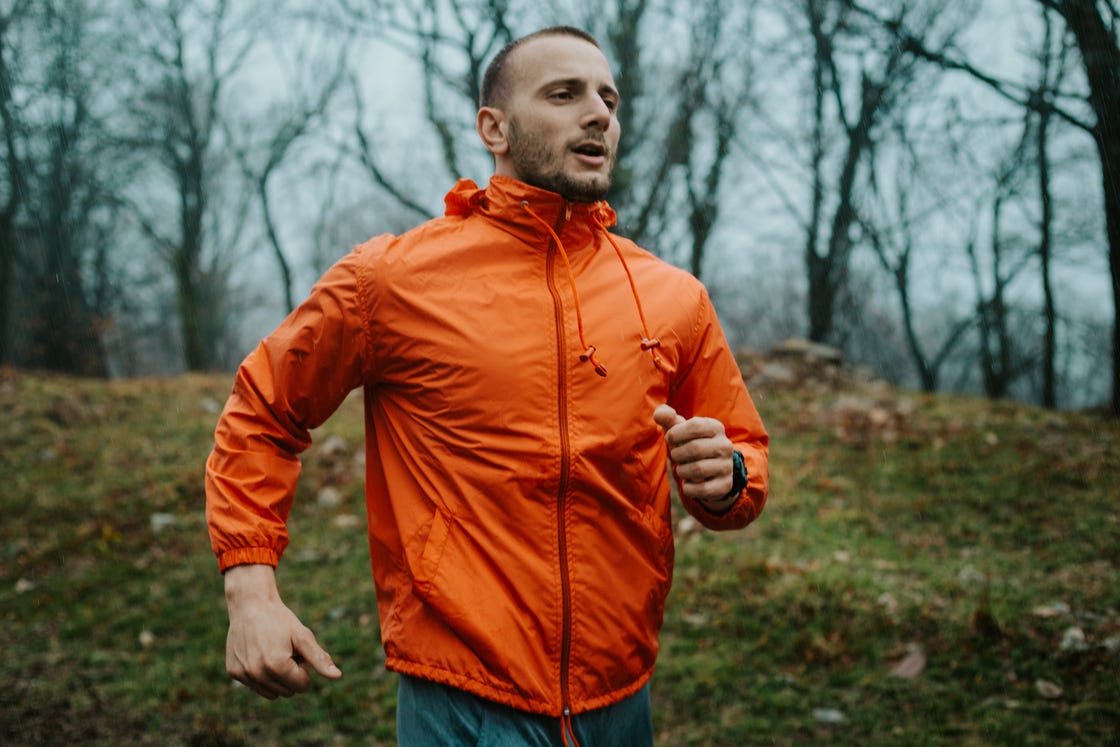 man is training in a bad weather condition