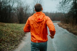 man is training in a bad weather condition