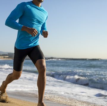 man jogging on the beach