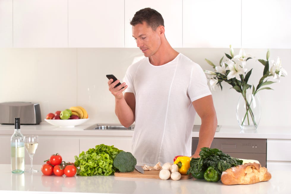 man looking up a recipe on his mobile phone