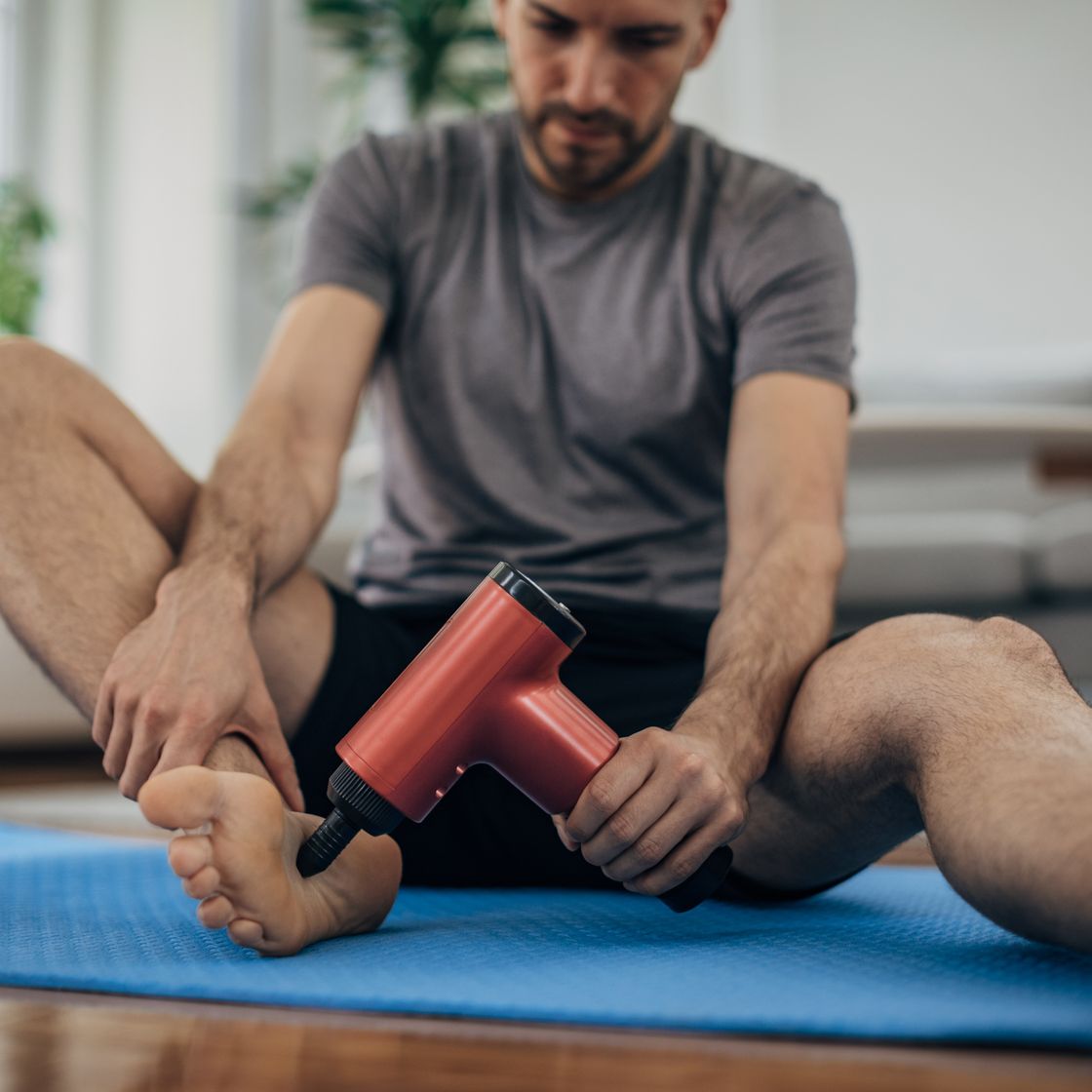 man massaging his foot
