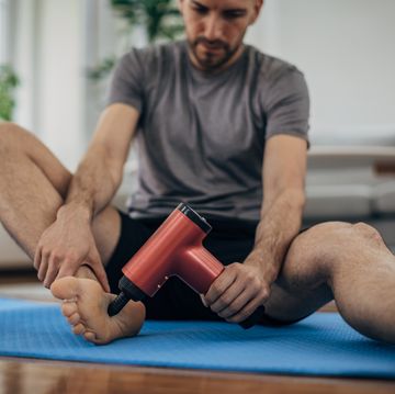 man massaging his foot