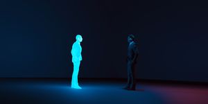 man meets digital avatar of himself made with a hologram