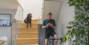 man on cycling trainer at home