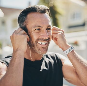 man on fitness run, listening to music and happy to start cardio running training exercise. sports athlete excited for physical wellness health run, energy workout and increase performance as runner