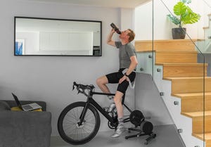 man on his turbo trainer at home