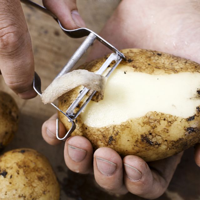 Man peeling potato