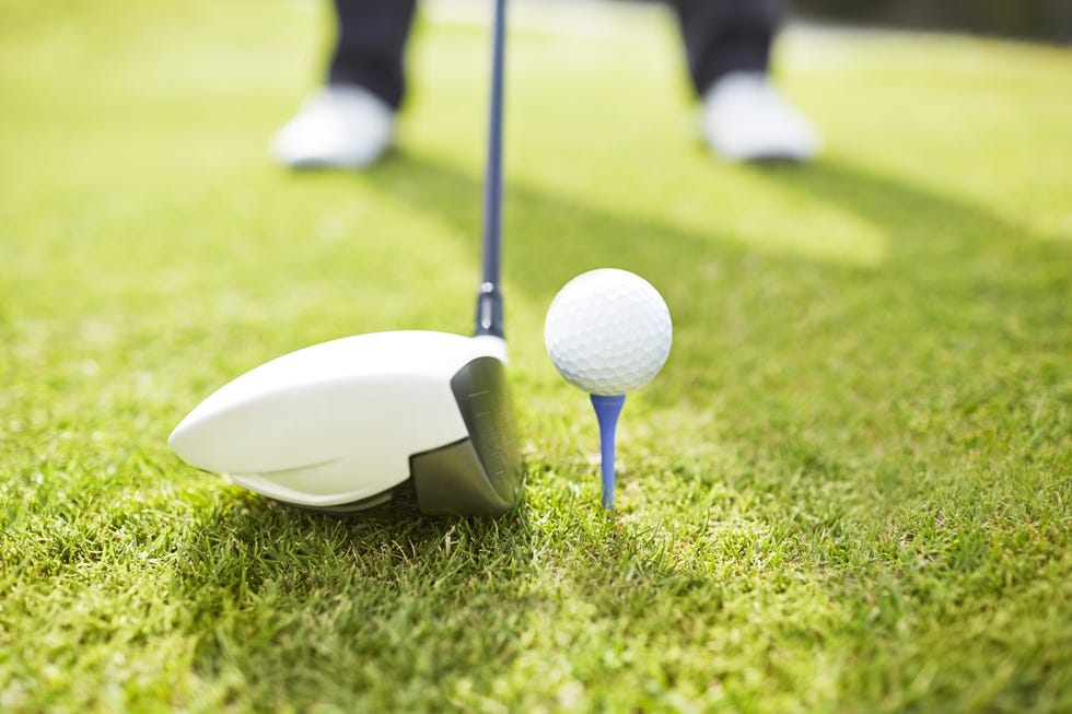 Man playing golf on course