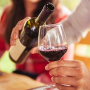 Man pouring red wine into glass man pouring red wine into glass