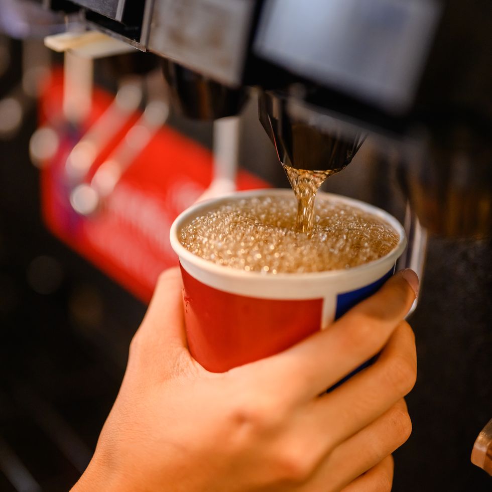 man pours a fizzy drink.sparkling water.cool ice soft drink cola