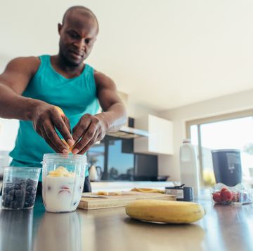 man preparing breakfast in kitchen