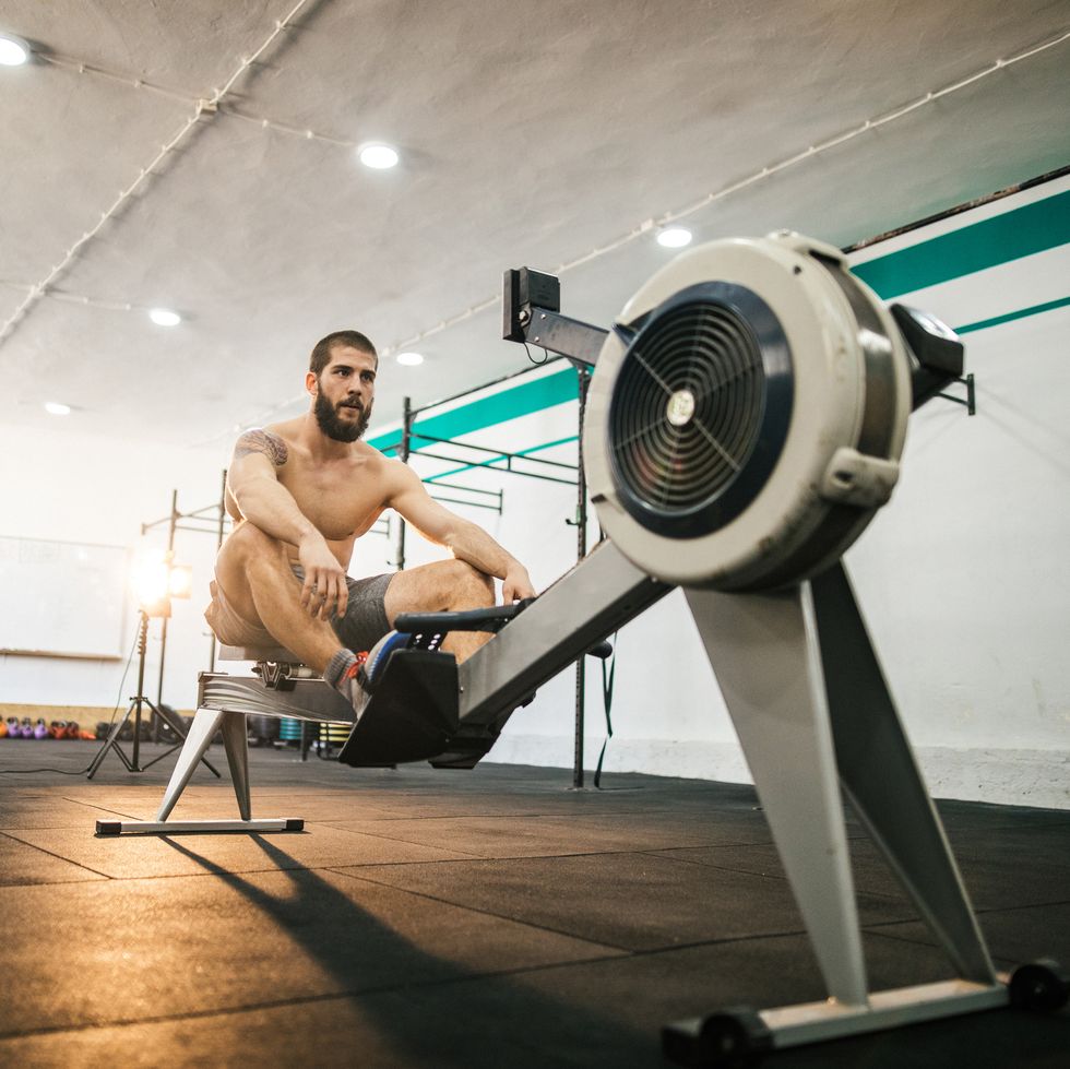 Man preparing for a rowing in the gym