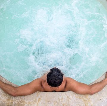 man relaxing in a hot tub