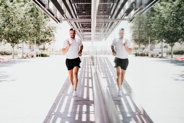 man running along a building