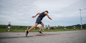 man running and training on running track