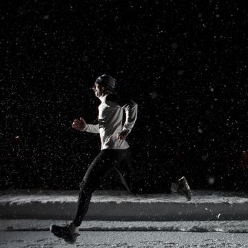 tips for running shorts at night man running shorts at night in snowstorm