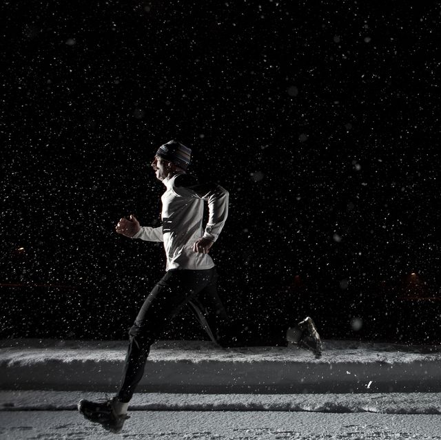 tips for running at night man running at night in snowstorm