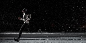 tips for running at night man running at night in snowstorm